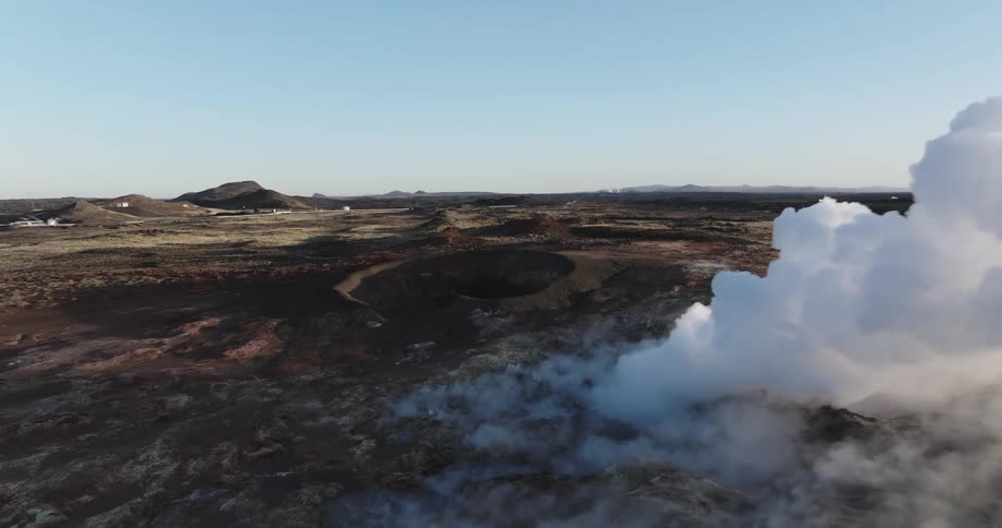 Landscape of a field exhaling smoke