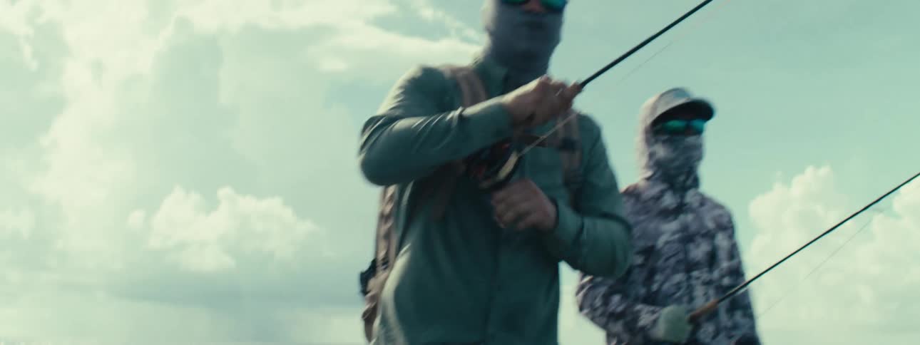 Two men fishing in the ocean on day time
