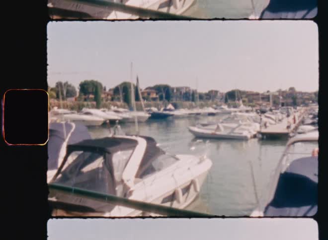 Yachts anchored in a marina during summer