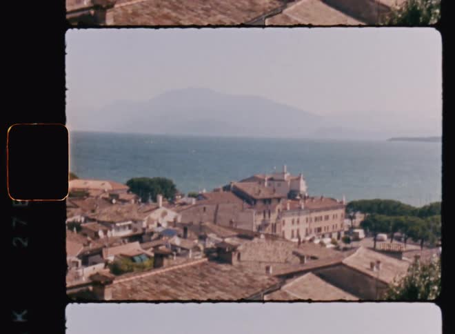 Aerial of a coastal city with ocean and mountains
