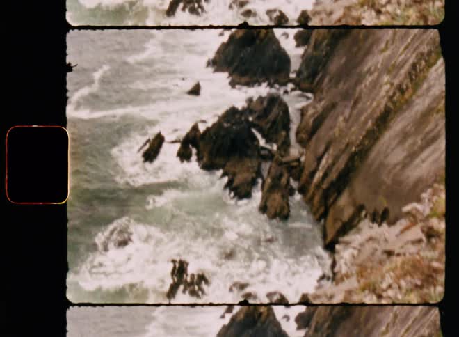 Sea waves breaking on the rocky mountain coast