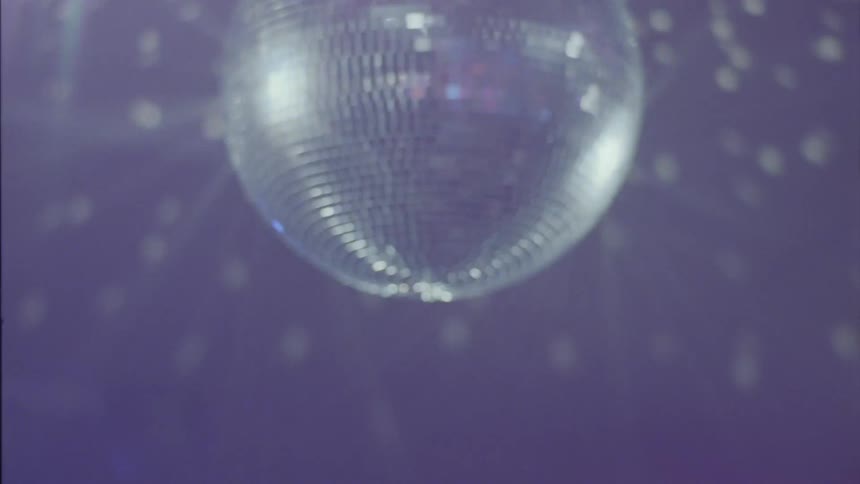 Older woman dances with others at dance club