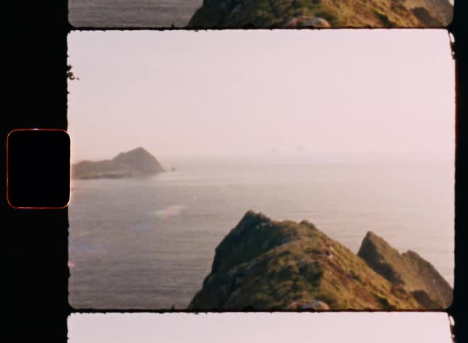 Gentle waves lap around small islands in the ocean