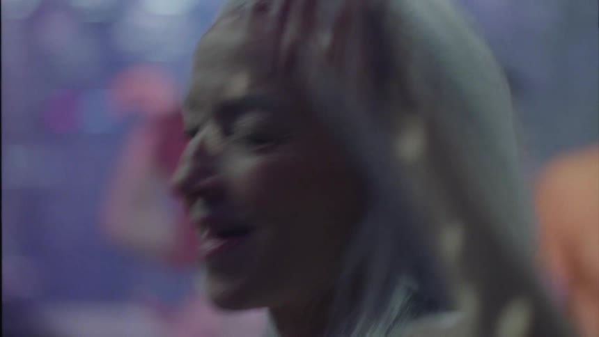 People smiling and dancing at a party at night