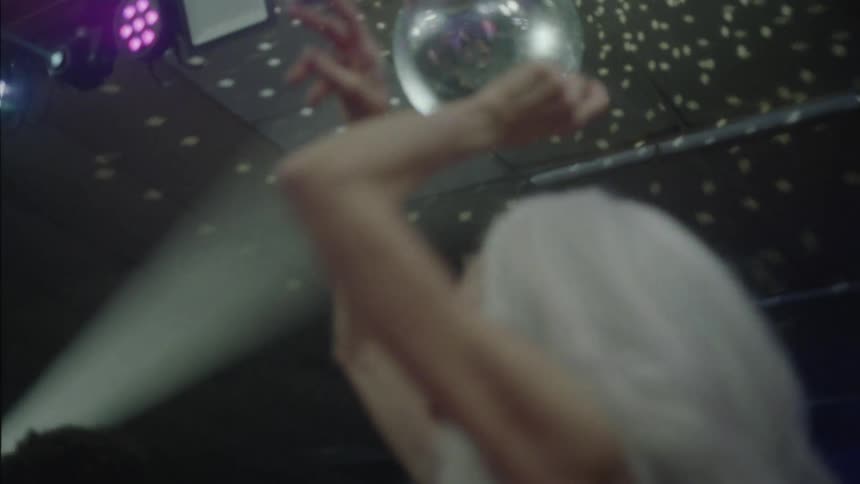 A lady dancing in a nightclub during a party