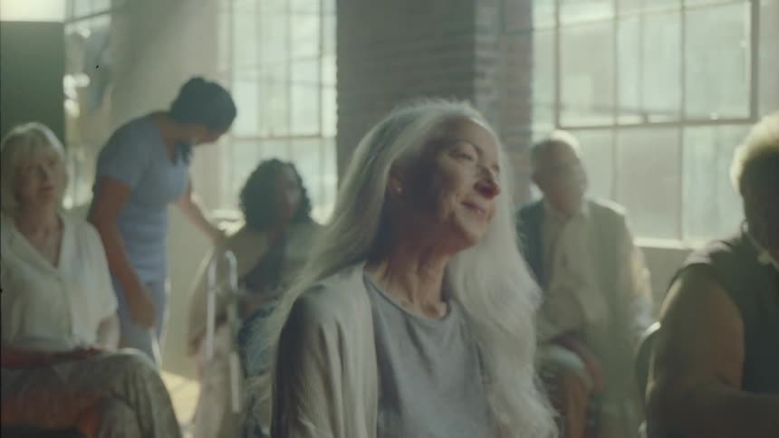 People are listening to something in a retirement home