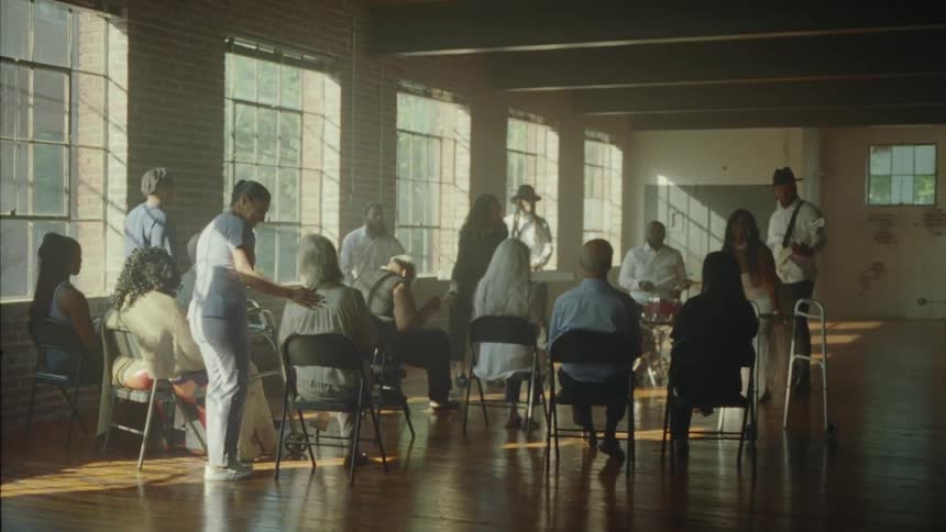 Musical group performing in a hall for a nursing home