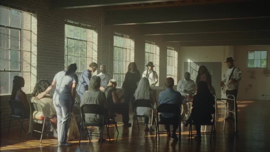 A band playing for a group of patients at a clinic
