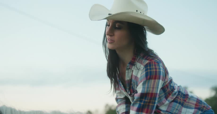 A woman is petting her horse