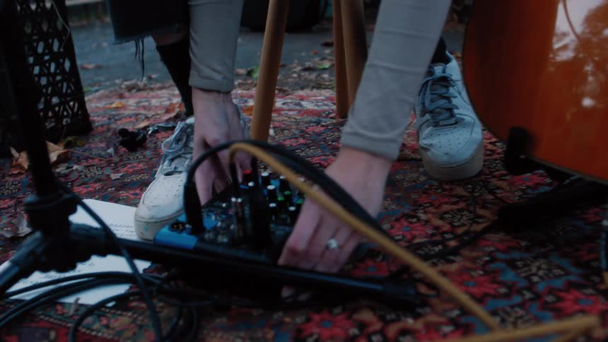 A person setting up a musical instrument