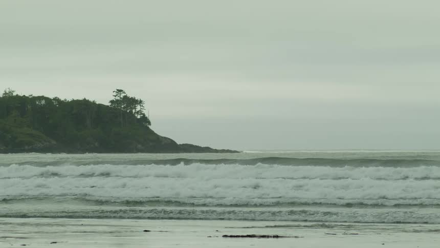 Waves washing on the shoreline of a beach