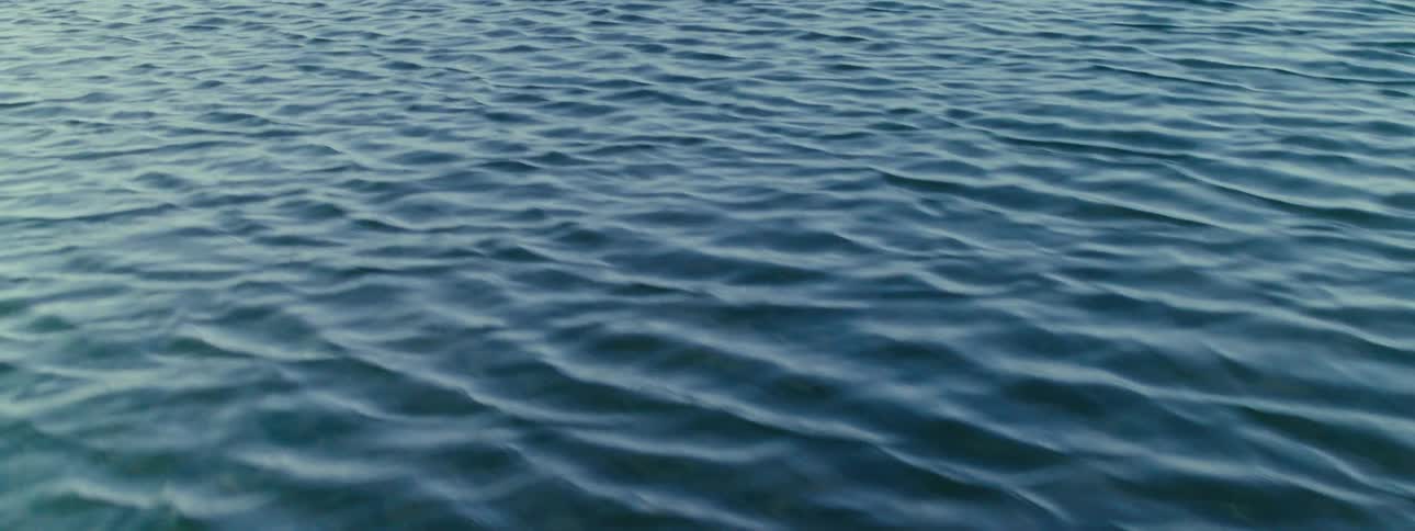 View of the blue sea with light waves