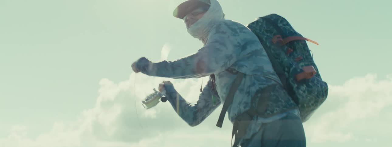 A man fishing wearing sunglasses