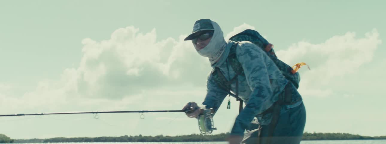 A man fishing in the sea with a fishing rod