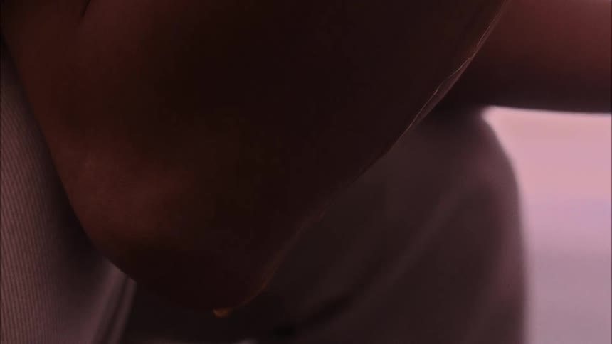 Drop of sweat rolling down the arm of a person