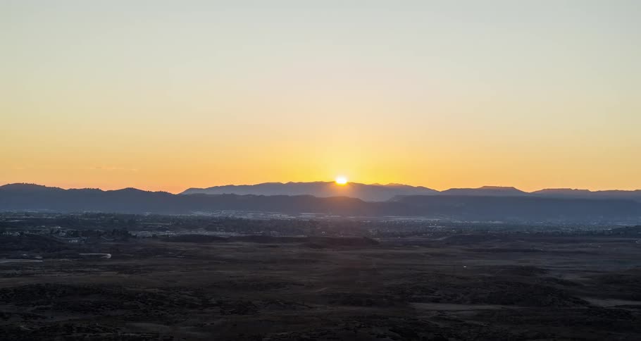 Aerial of desert plain during sunset