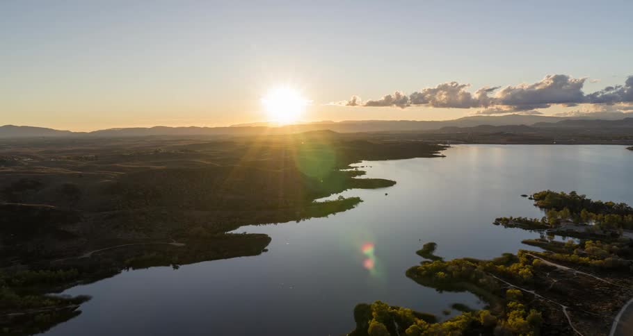 Aerial of the waterway cutting through the forest during dawn
