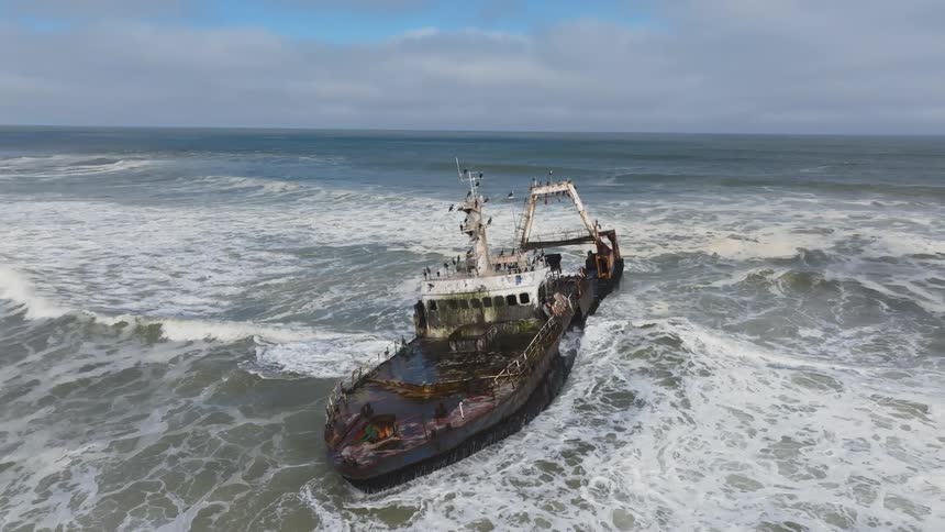 An old ship on the sea at midday