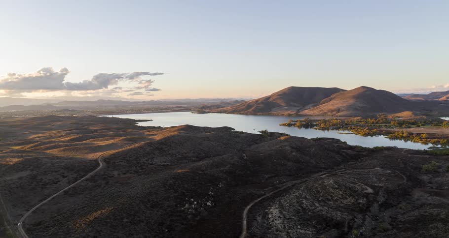 Aerial panorama of a central river amidst plateau and mountains
