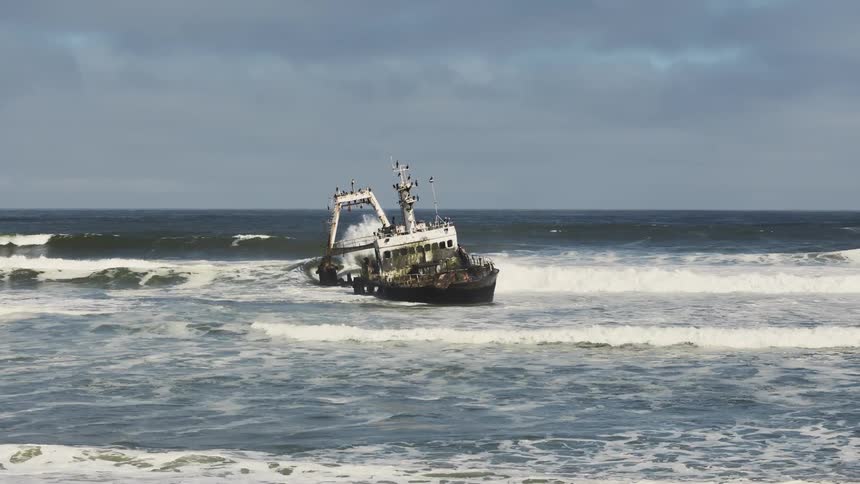 A clip of a boat on the beach shore side