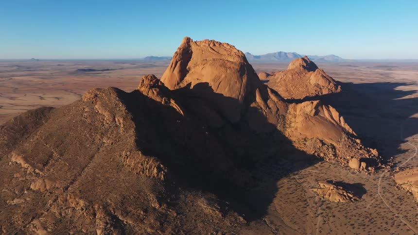 Aerial of mountain in desert during hot day