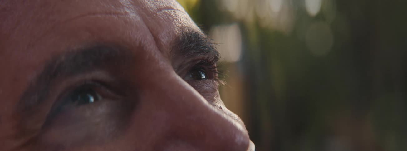 Close up of a senior mans eyes looking up