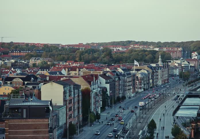 Traffic on an avenue in an european city at evening