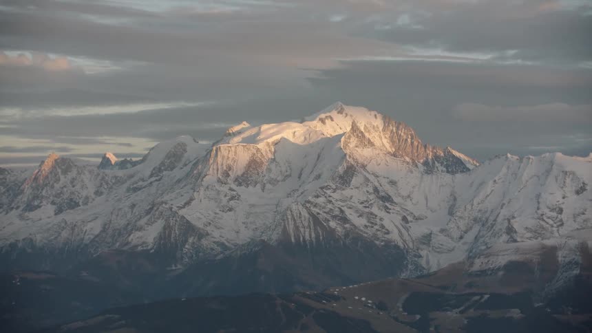 Rocky mountain peak with ice and snow during the morning