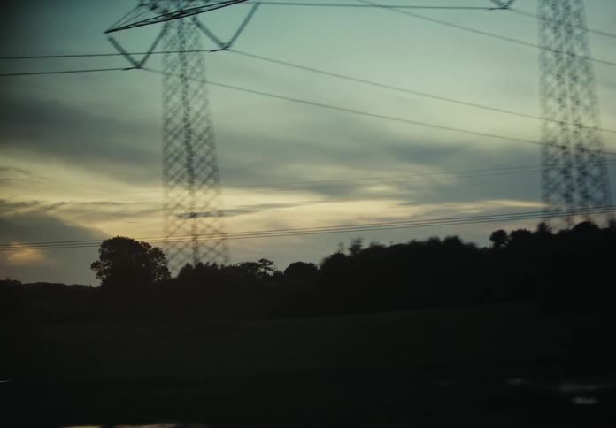 Evening sky seen from a car driving through the countryside