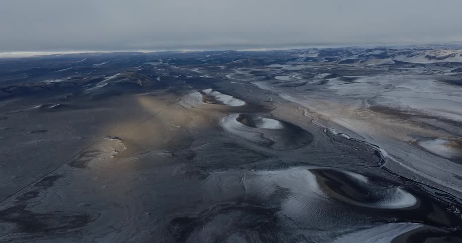 Aerial of sandy desert at dusk
