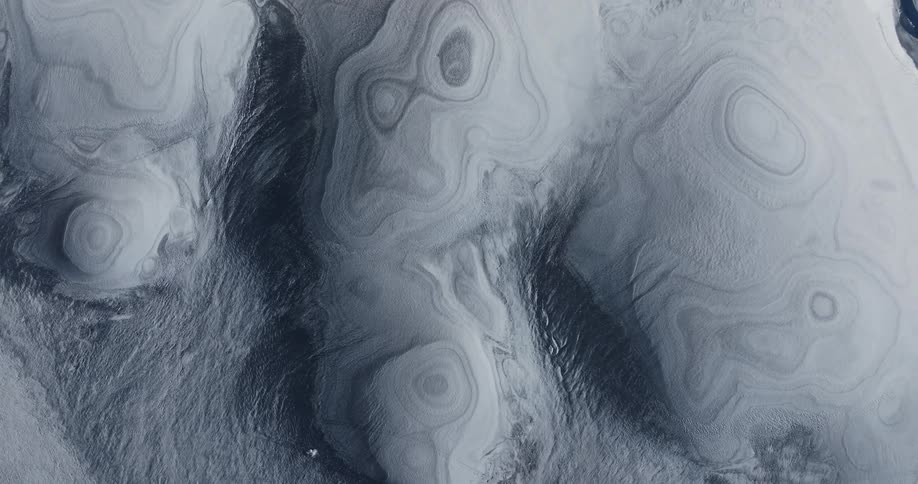 An aerial view of white textures and round shapes