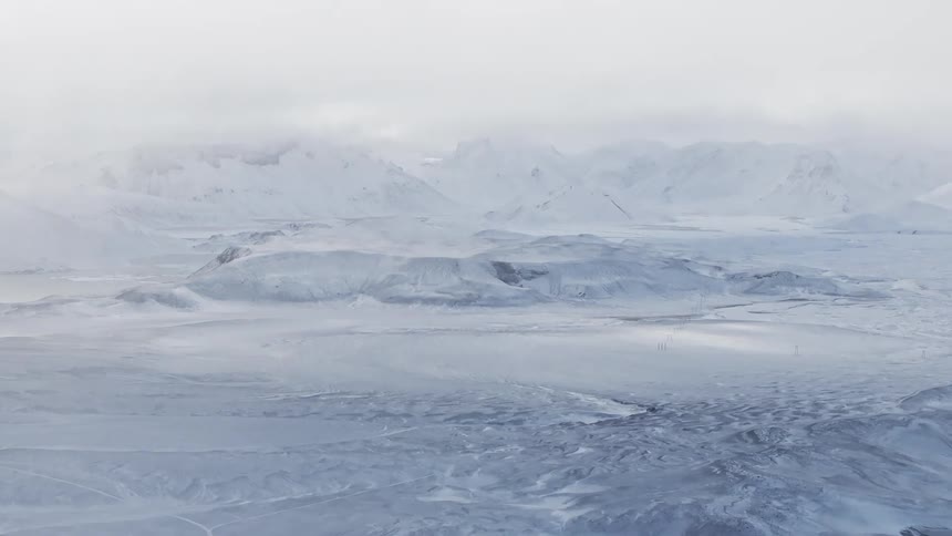 Aerial view of a landscape under a snow storm