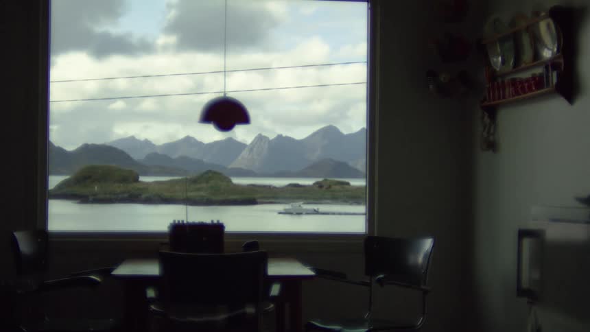 Time lapse of clouds rolling over a lake seen from a home