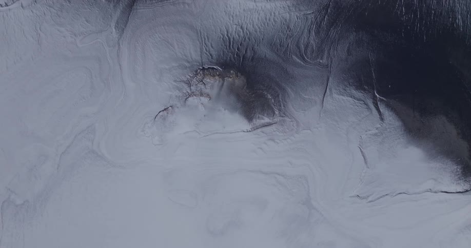 Top down aerial view of snow covered landscape