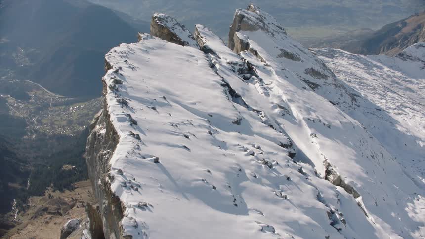 A small town is at the bottom of the mountain range
