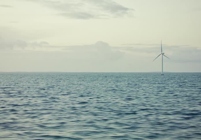 Turbine on the ocean during the day