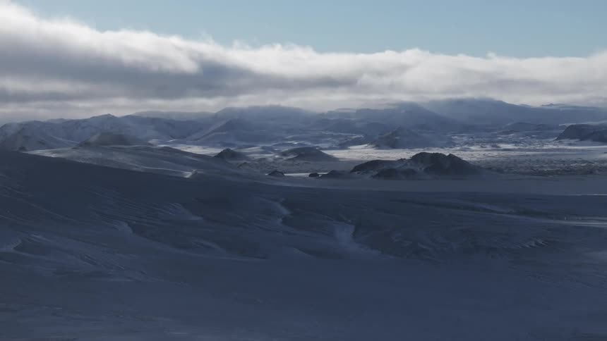 Aerial of hills and plains during winter