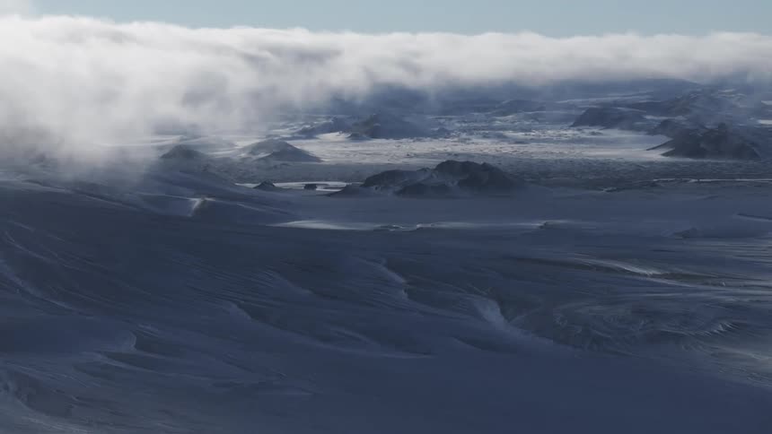 Skyline of mountains with snow during winter at dusk
