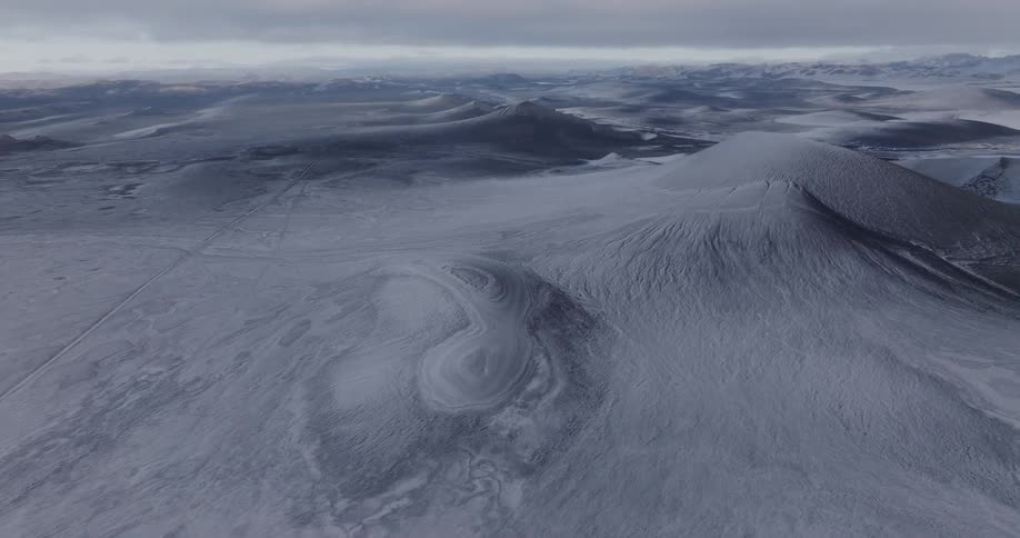 Mountains covered by ice and snow at dusk