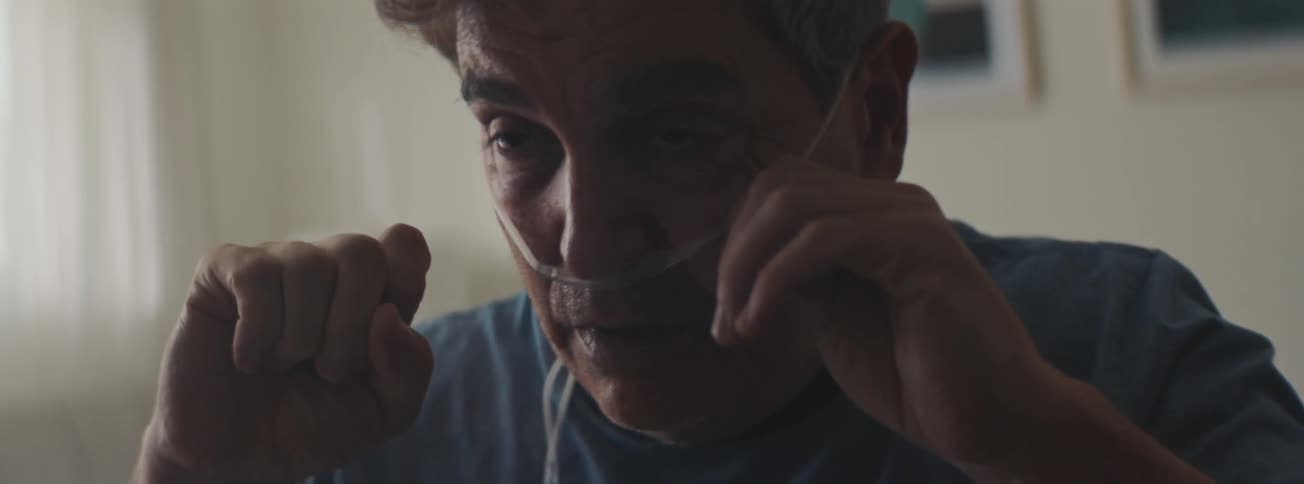 Portrait of a senior man feeling unwell with a nasal catheter