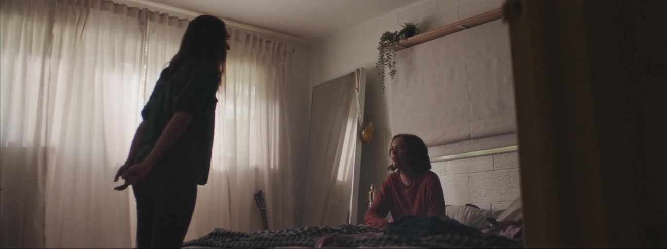 Mother and daughter arguing in the bedroom