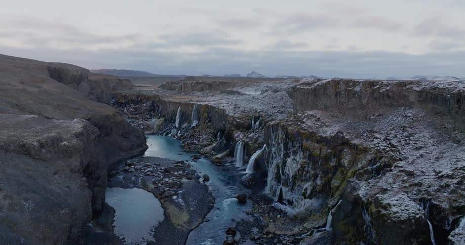 View of craters with cliffs a river and waterfalls