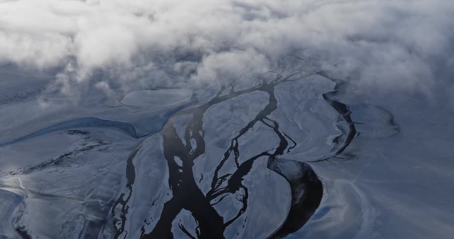 Water runs around the ice