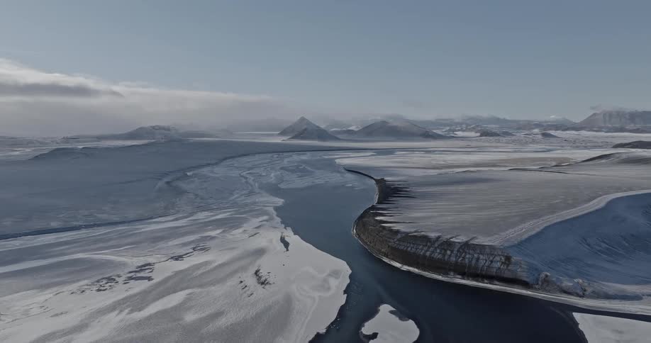 A river that passes through a region with snow on the ground