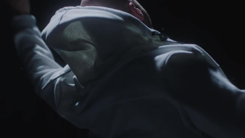 A man in white hoodie falling