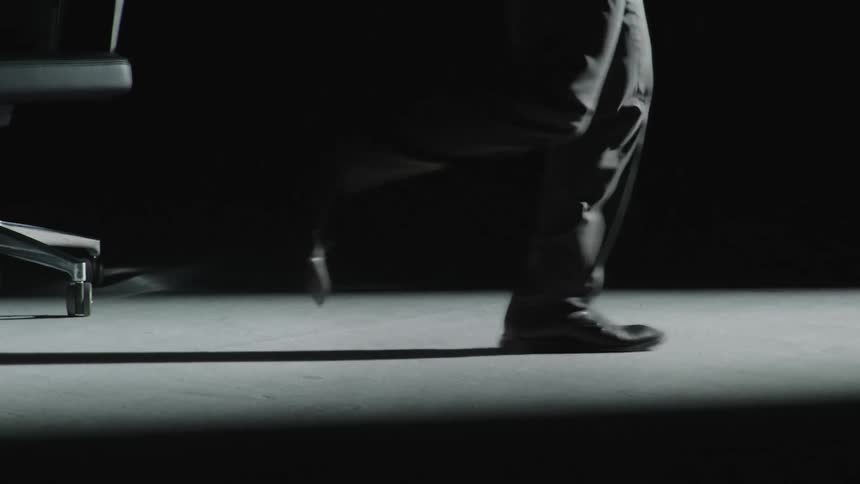 Legs of a man running at the same spot indoor