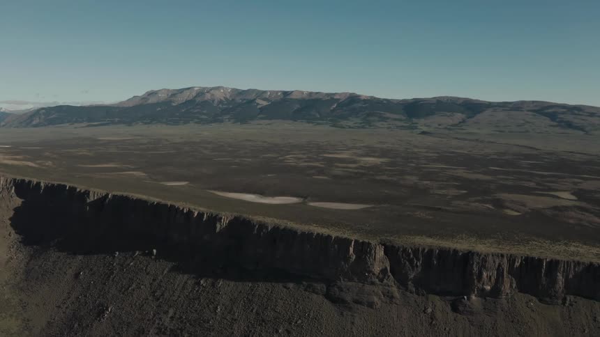 Aerial view of a mountain range in the tundra plains