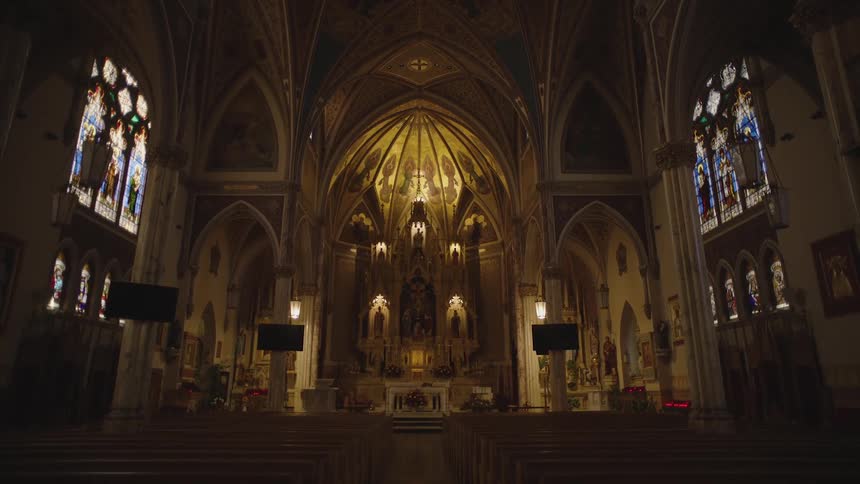 Internal architecture of a church with an illuminated altar