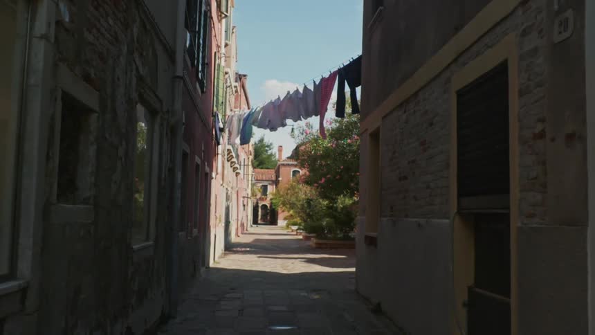 A path in an alley between old structures in a city