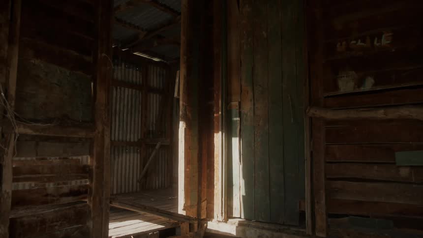 An empty and unused farm building in the daytime